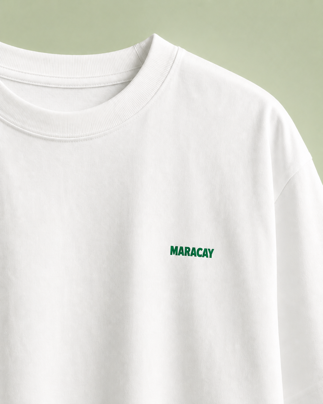 White t-shirt with 'MARACAY' logo on a light green background